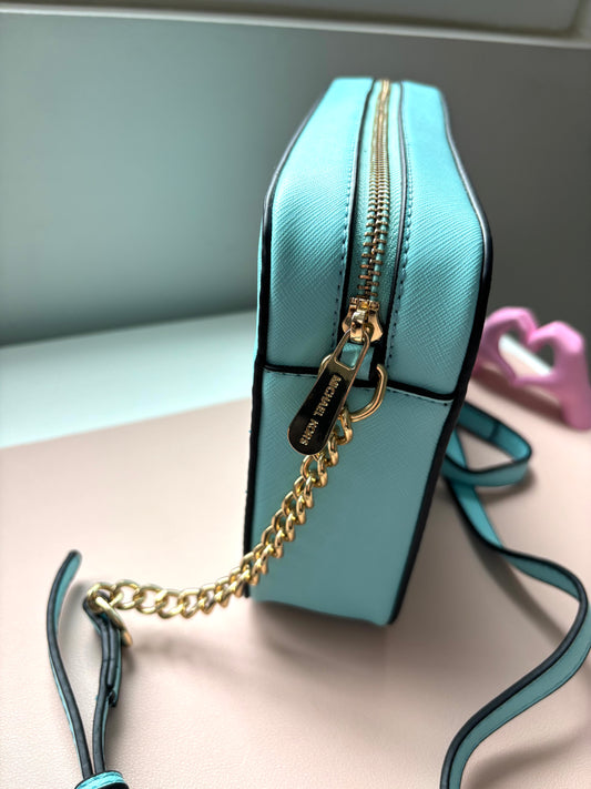 Bandolera MK celeste bebe