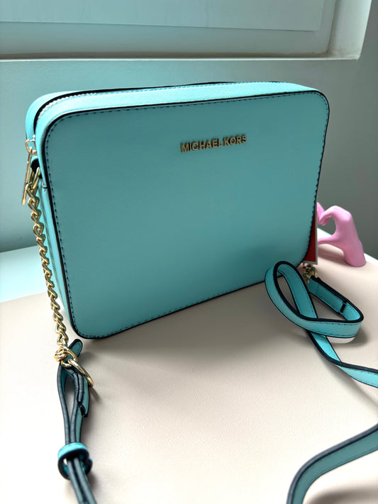 Bandolera MK celeste bebe